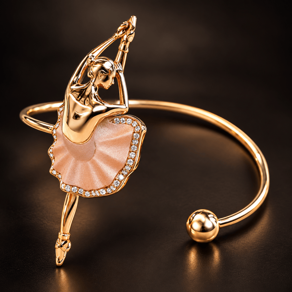 A gold bracelet featuring a ballerina figurine with a pink skirt, adorned with sparkling rhinestones.